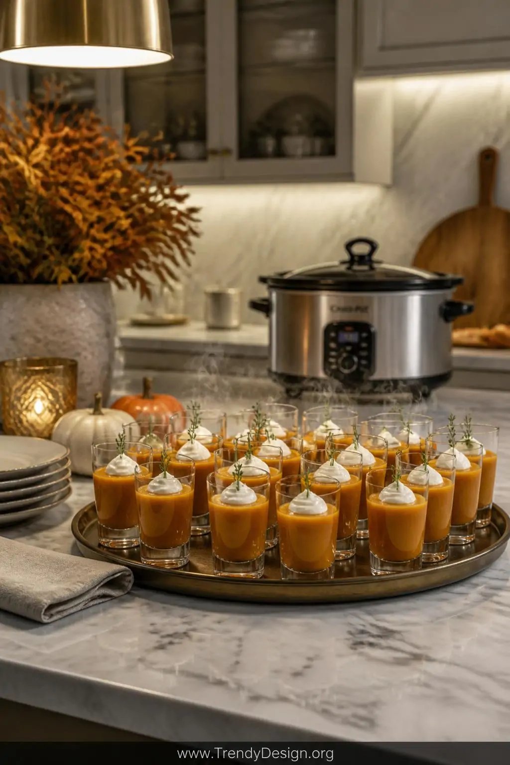 A sleek marble countertop styled for an elegant autumn party, medium shot showcasing a tray of small clear shot glasses fille