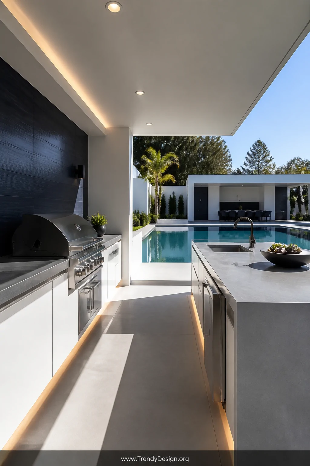 Medium-shot photorealistic interior design image of a sleek modern outdoor pool pavilion kitchen featuring a crisp flat-roof 
