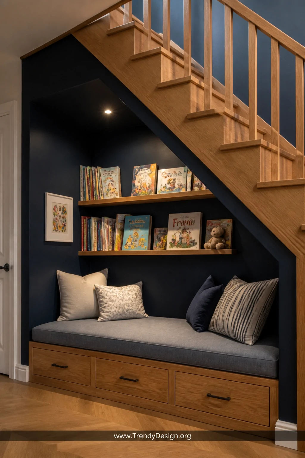 Medium photorealistic interior shot of a built-in reading nook tucked under a wooden staircase, walls painted a deep navy blu