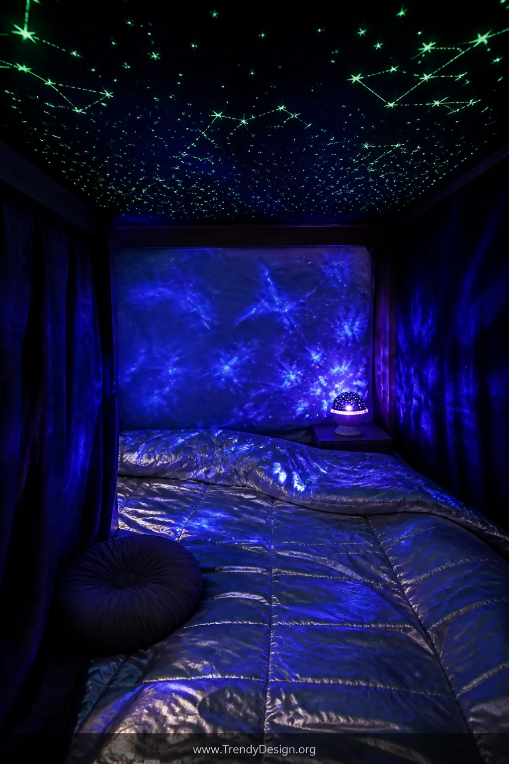 Medium shot looking into the interior of a bottom bunk fort with deep black and navy curtain panels drawn around the sides, t