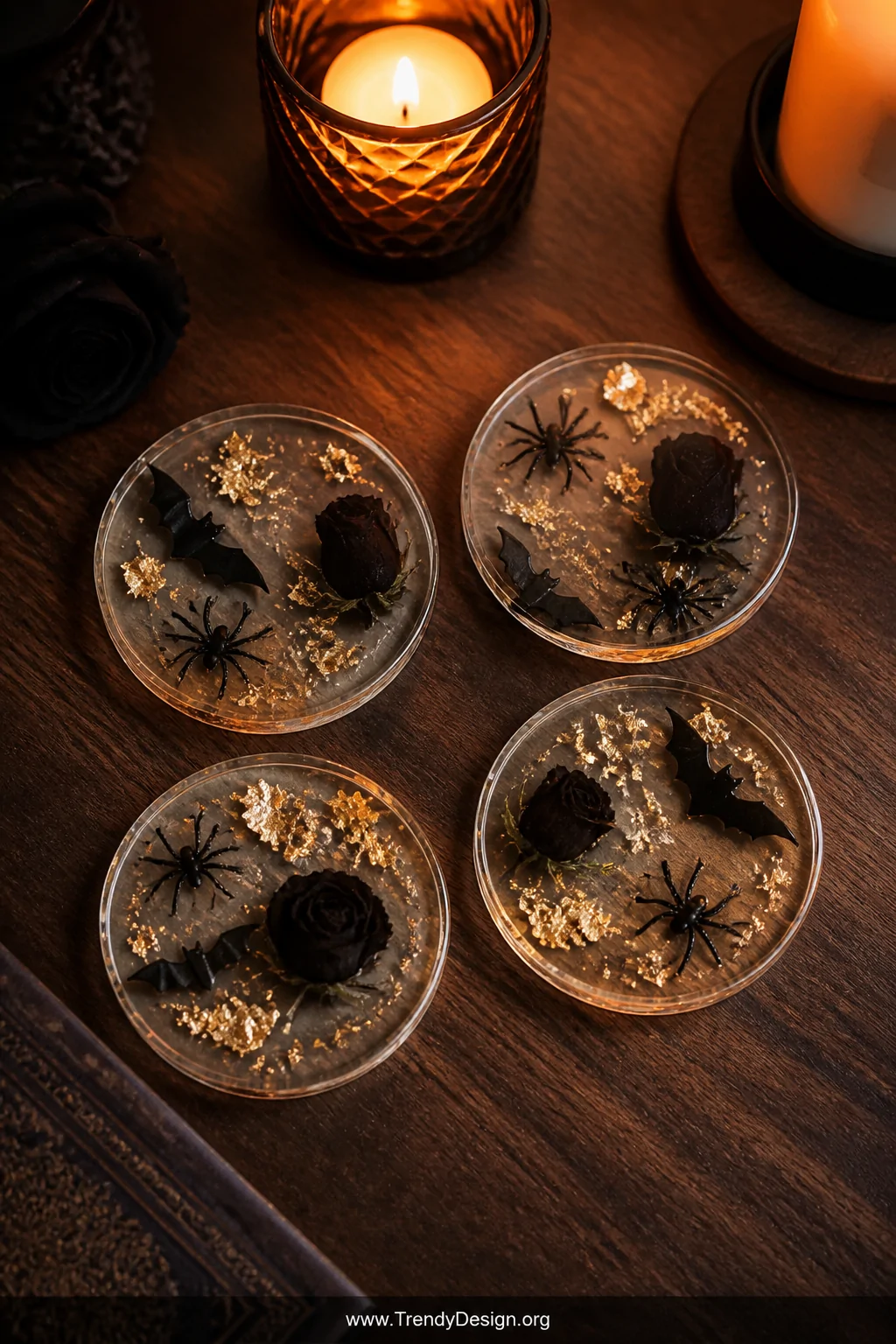 Medium overhead flat-lay shot of four circular Halloween resin coasters arranged on a dark walnut coffee table, each embeddin