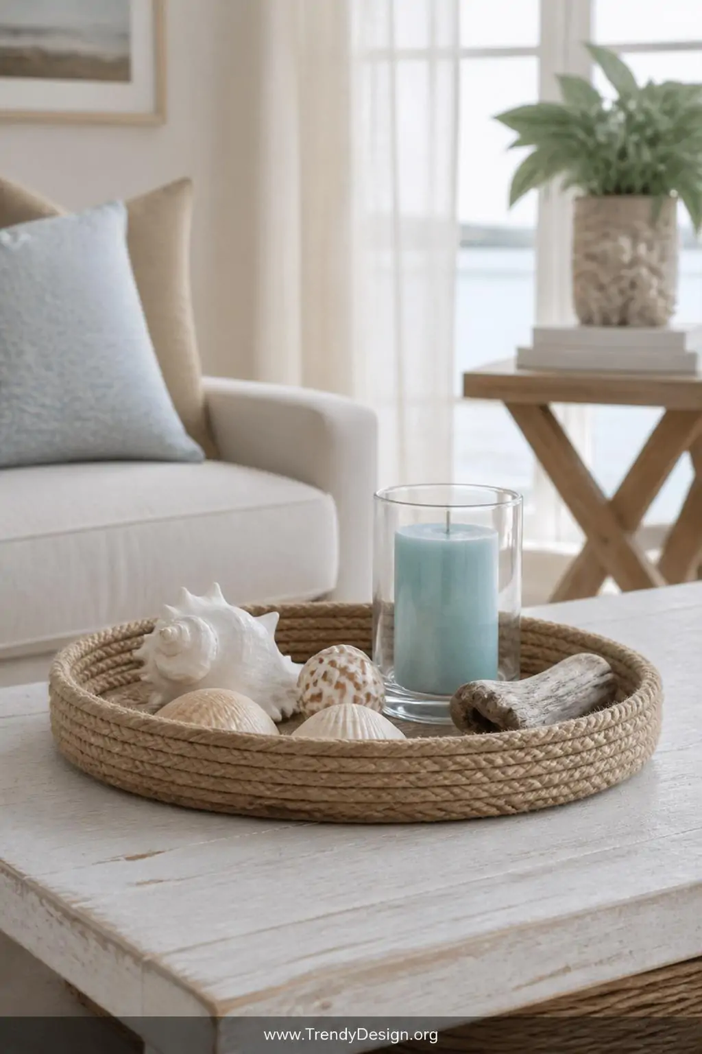Medium shot of a round thrifted tray with edges tightly wrapped in natural jute rope resting on a whitewashed coffee table, s