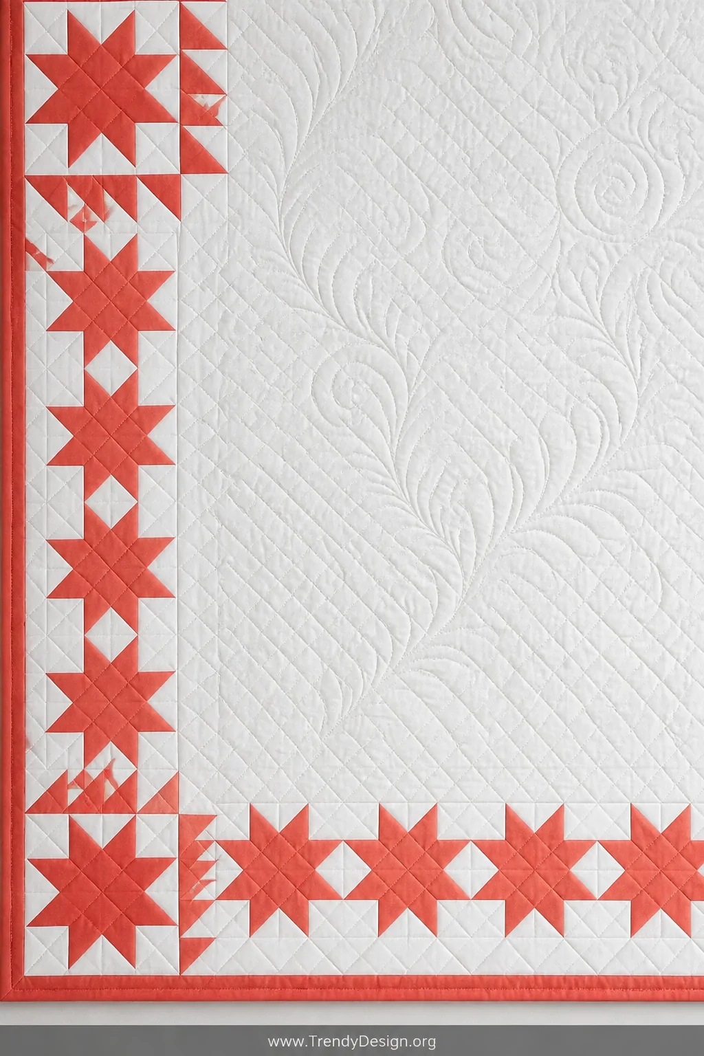 Detail closeup of a crisp geometric sawtooth star border on a flat quilt, each small star precisely pieced in a single bold c