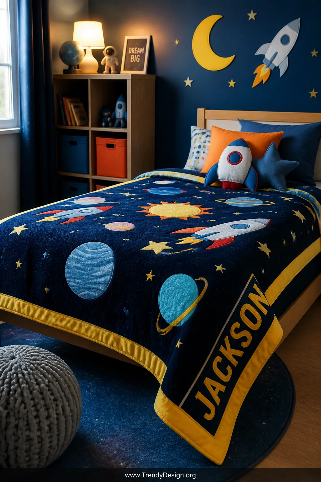 Medium shot of a vibrant kids' bedroom with a bold outer space themed fleece quilt spread across a low wooden bed frame, deep