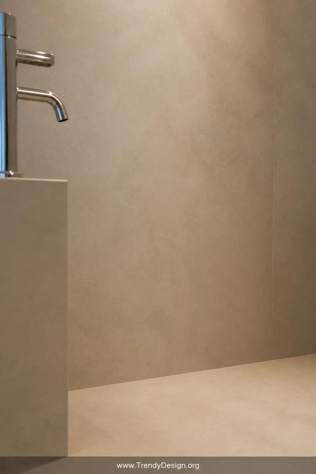 Close-up photorealistic interior design shot of a small bathroom wall and floor where soft warm taupe tiles are perfectly mat