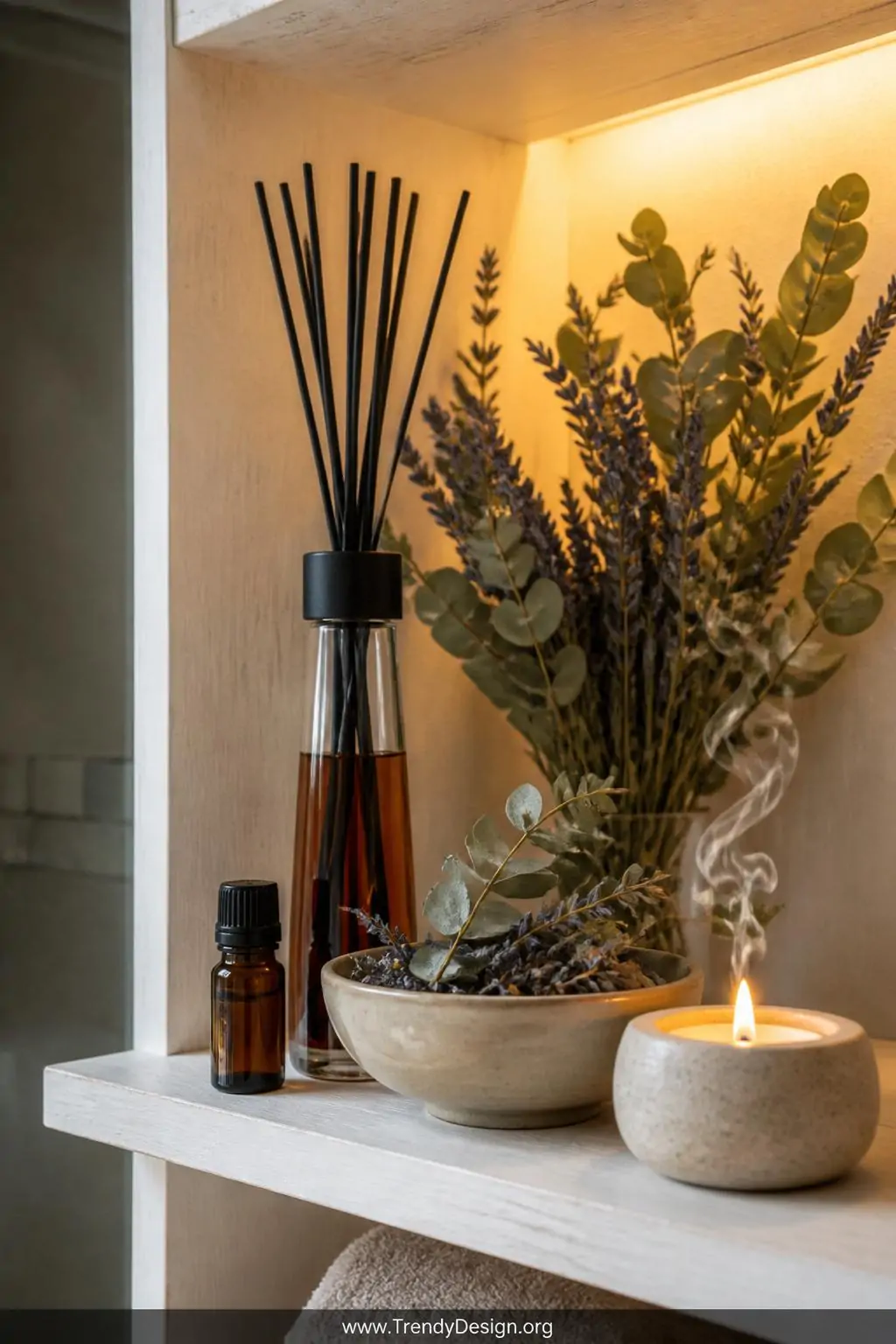 A photorealistic closeup of a bathroom shelf styled as a scent sanctuary, showing a tall slender reed diffuser with dark ambe