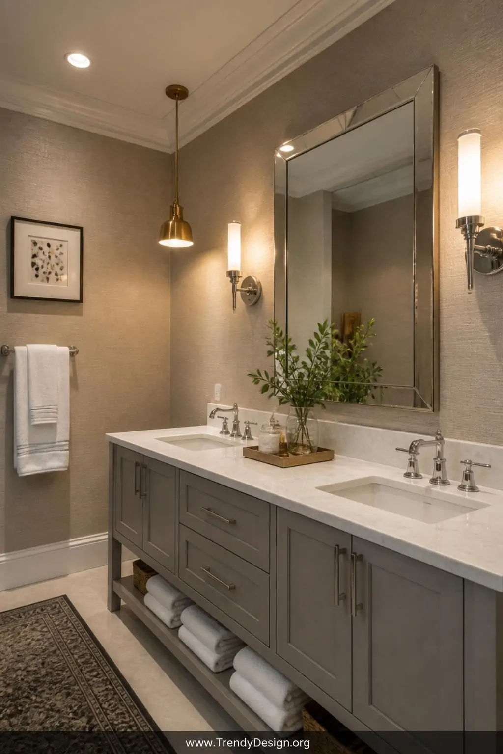 A medium-shot layered-lighting bathroom interior combining warm recessed ceiling fixtures, elegant chrome vanity sconces flan
