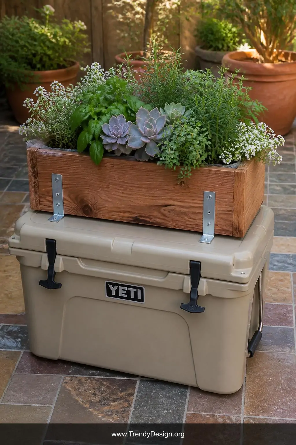 A rustic cedar planter box mounted on a cooler lid with polished L-brackets, overflowing with lush green herbs, pale lavender
