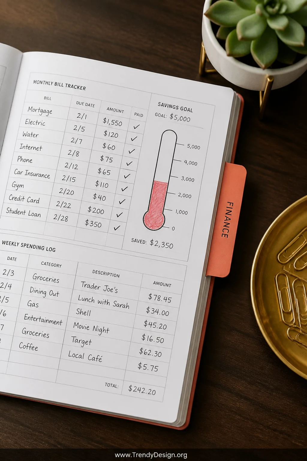 A close-up detail shot of a planner open to a finance tracking section tabbed in bright coral, showing a printed monthly bill
