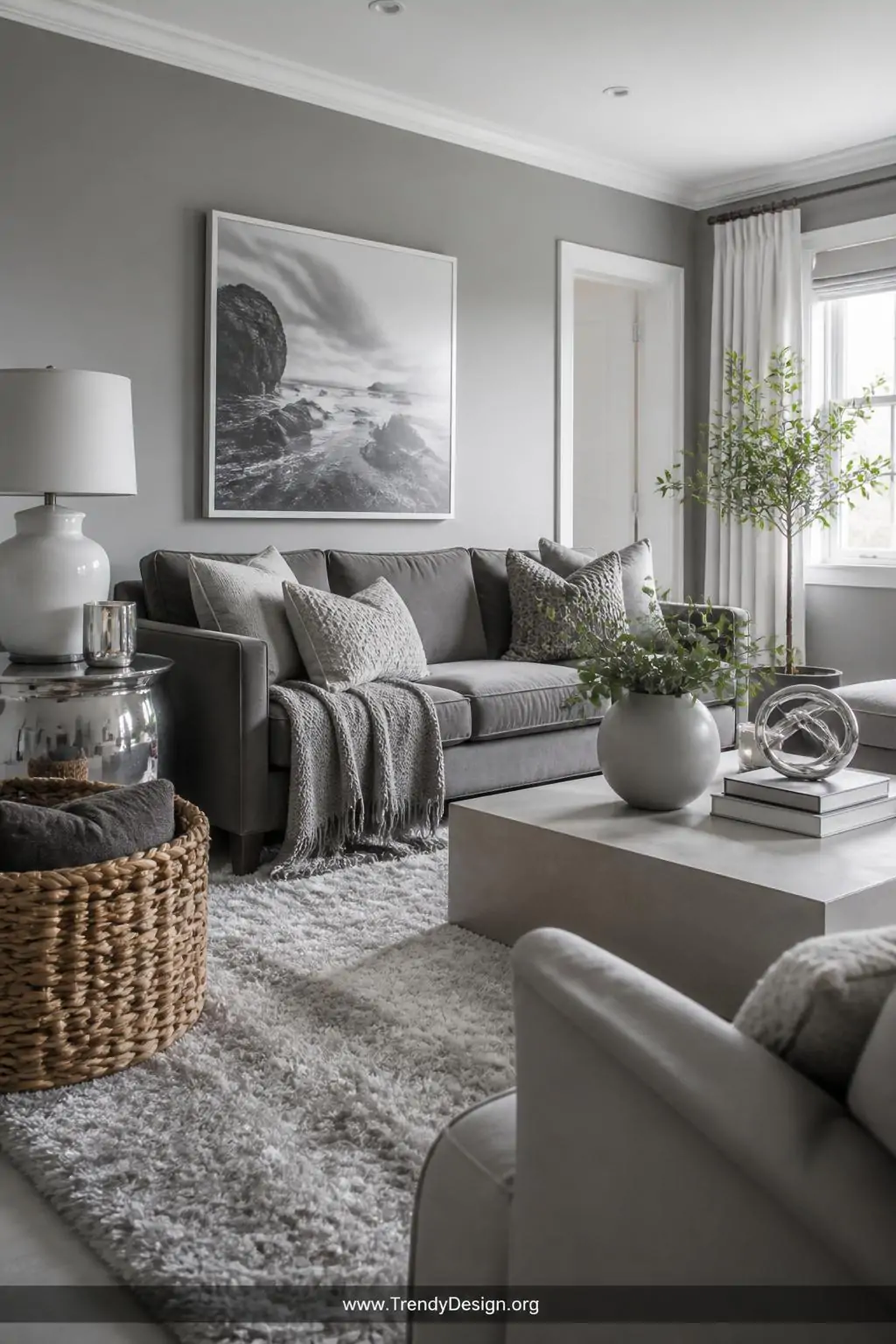 Wide-angle photorealistic interior design shot of a chic monochromatic gray family room featuring dove gray painted walls, a 