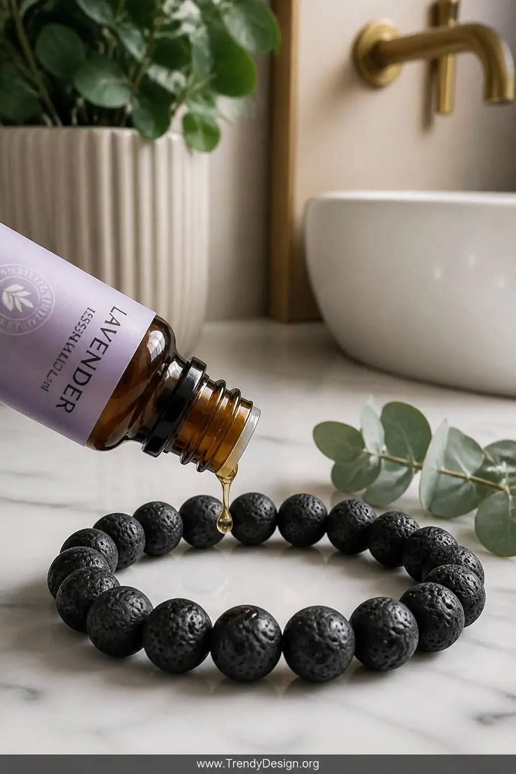 Closeup shot of a wellness vanity corner with a small amber glass essential oil bottle tipped toward a single oversized 10mm 