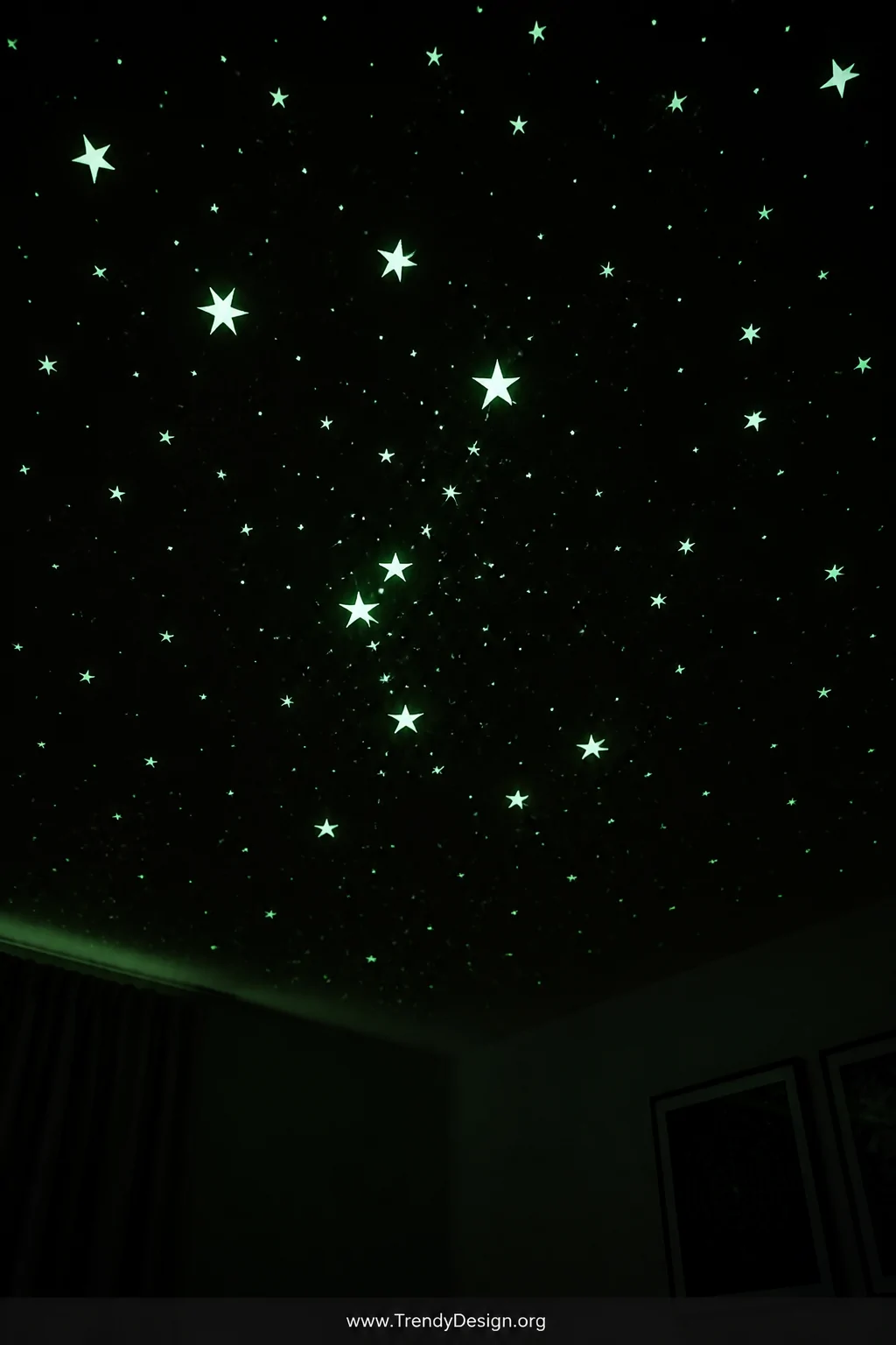 Close-up photorealistic detail shot of a dark bedroom ceiling completely covered in meticulously arranged glow-in-the-dark co