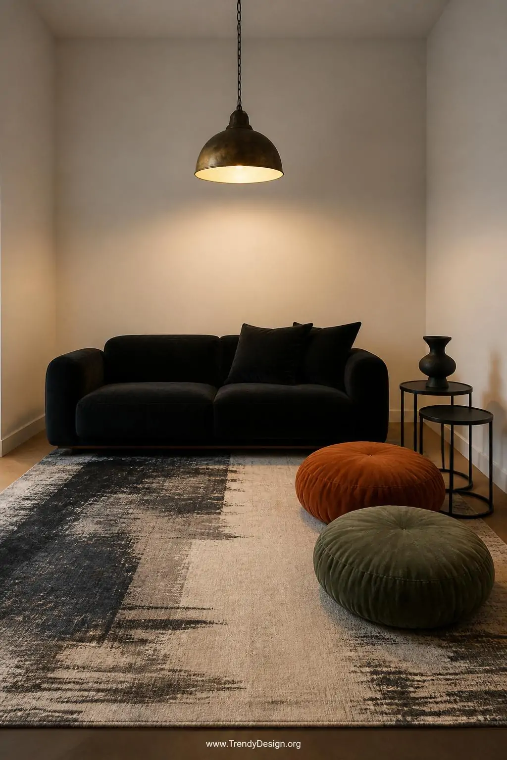 Photorealistic close-up medium interior shot of a single bold black velvet sofa standing alone as the sole seating anchor in 