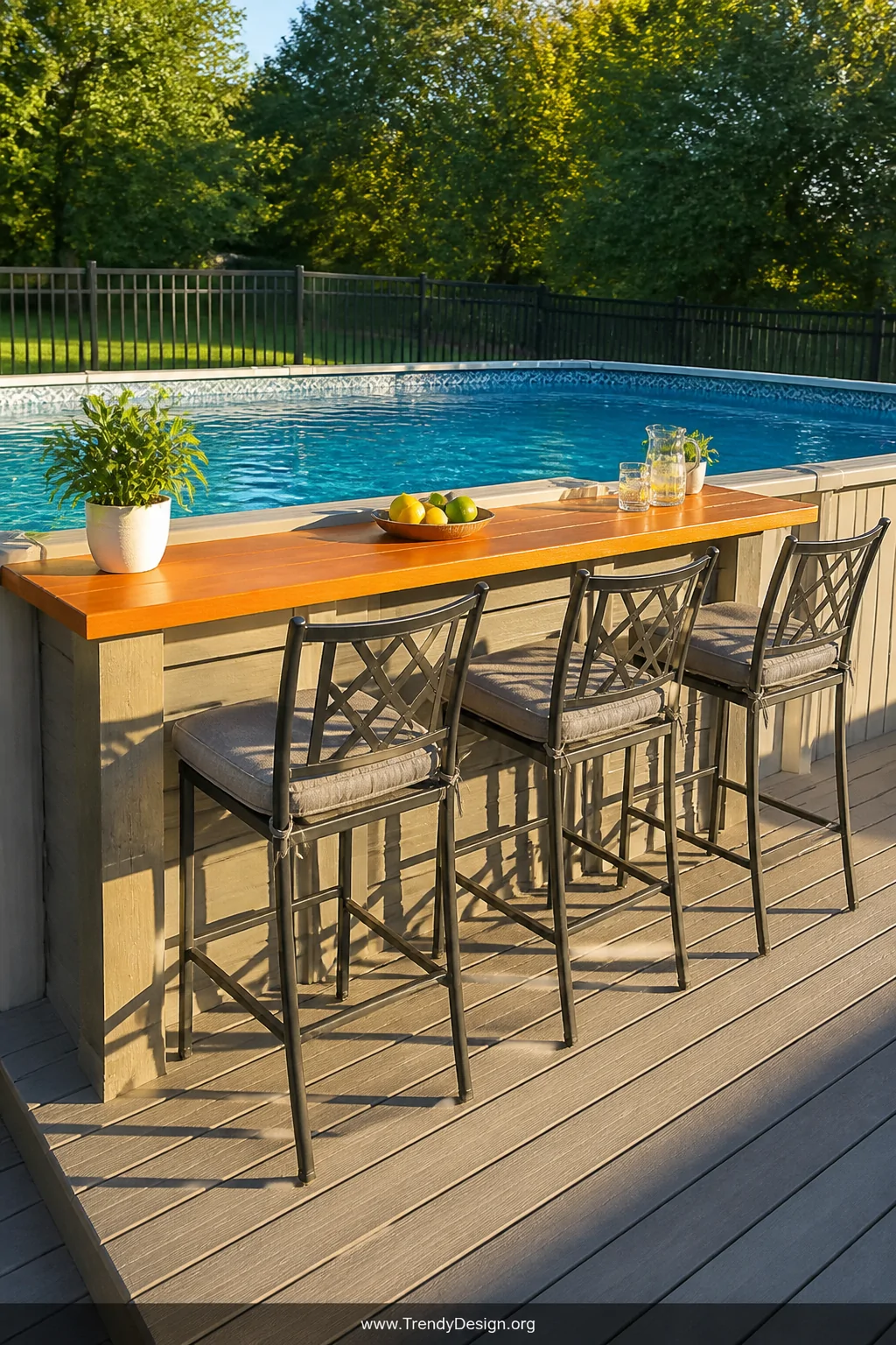 A wide shot of a permanent built-in pool deck bar framed with pressure-treated lumber and topped with a smooth natural cedar 