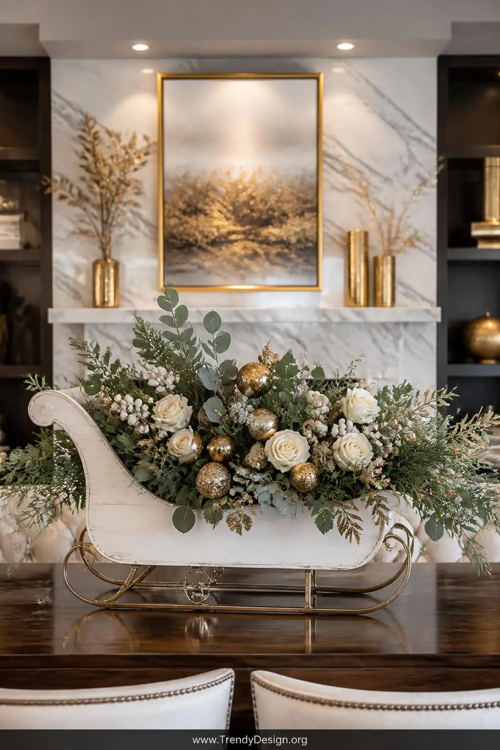 A medium shot of a polished dining room mantel centerpiece featuring an elegant white-painted wooden sleigh box overflowing w