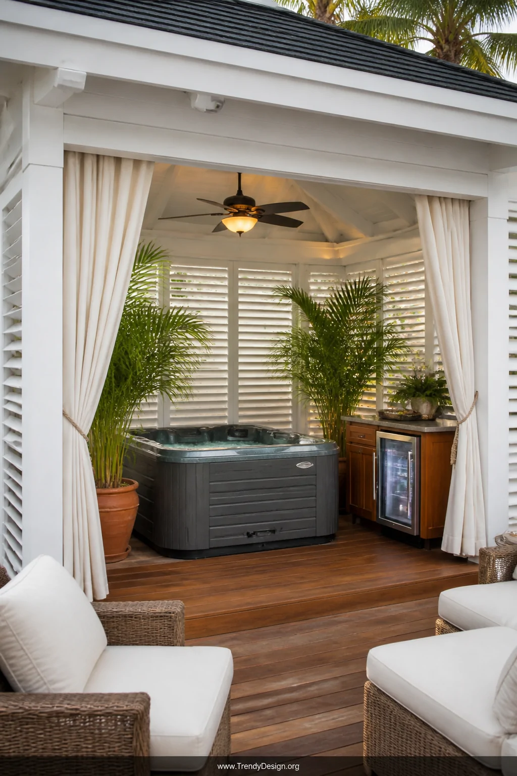 Medium photorealistic shot of a cabana-style hot tub enclosure with white-painted louvered timber shutters, flowing ivory out