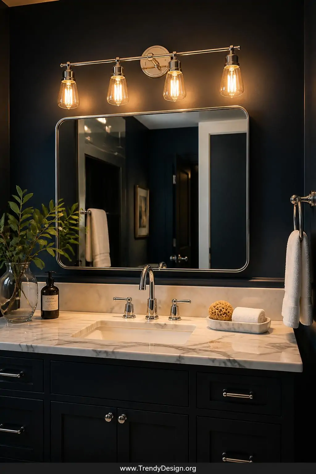 A sleek modern vanity light bar with warm amber Edison-style bulbs mounted above a bathroom mirror, medium shot capturing the