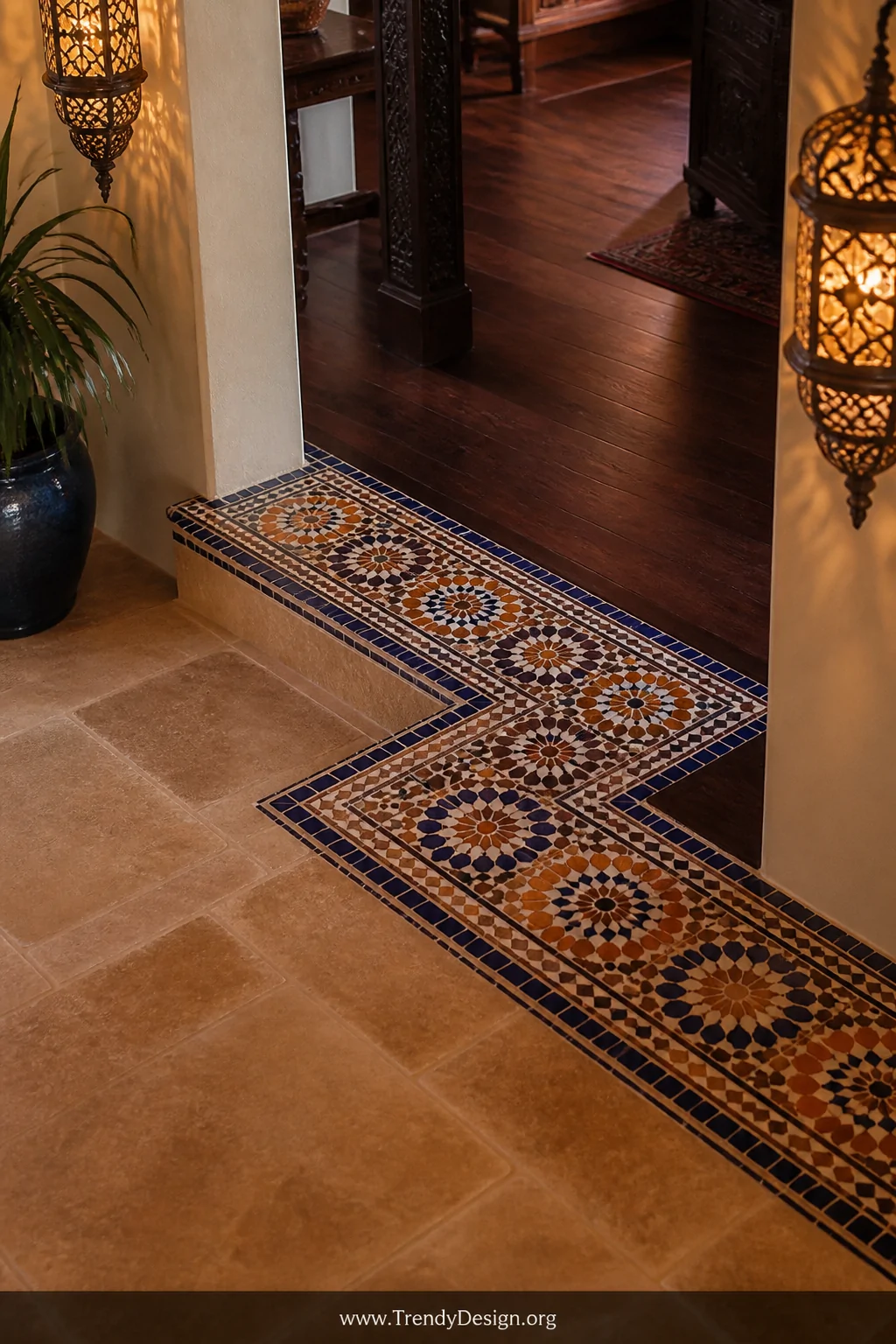 Medium shot looking down at an ornate mosaic tile inlay transition in a Mediterranean-style interior, small hand-glazed Moroc