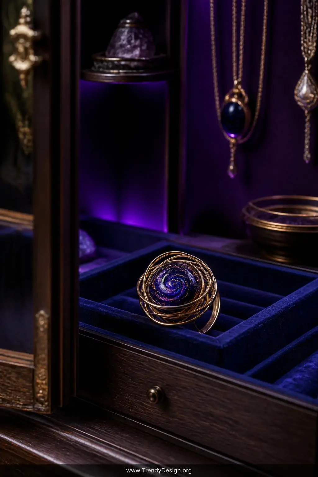 A medium shot of a dramatic galaxy swirl wire ring featuring deep midnight blue and purple resin cabochon flecked with gold, 