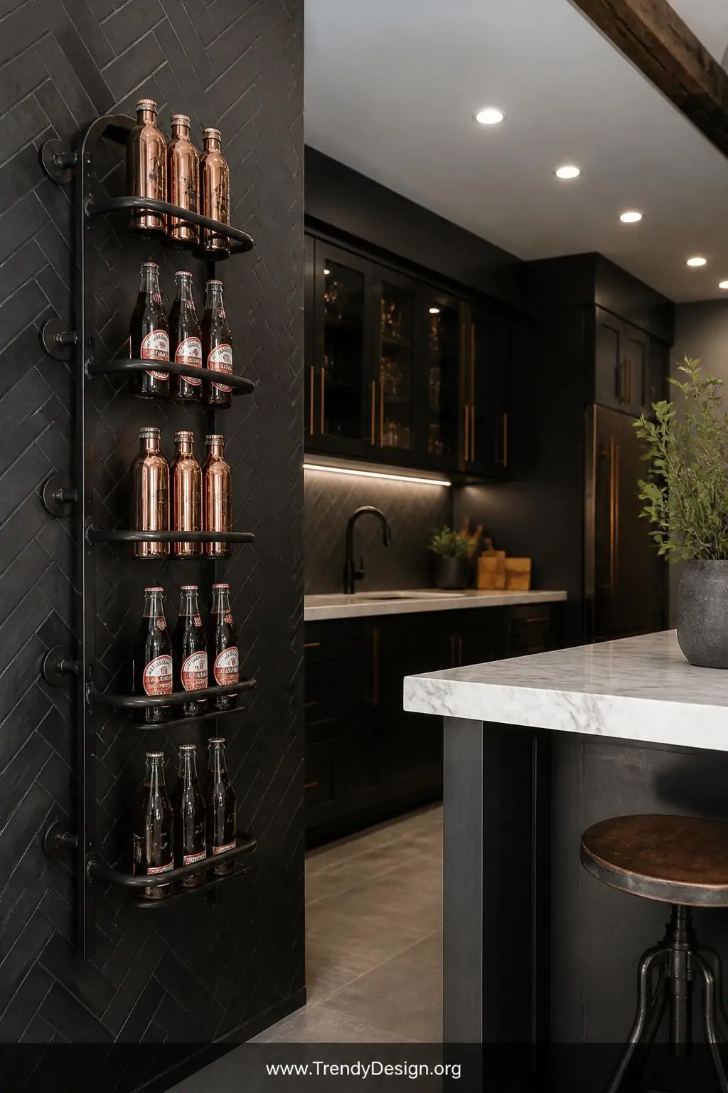A matte black iron wall-mounted bottle rack is anchored to a deep charcoal herringbone tile kitchen wall beside a white marbl