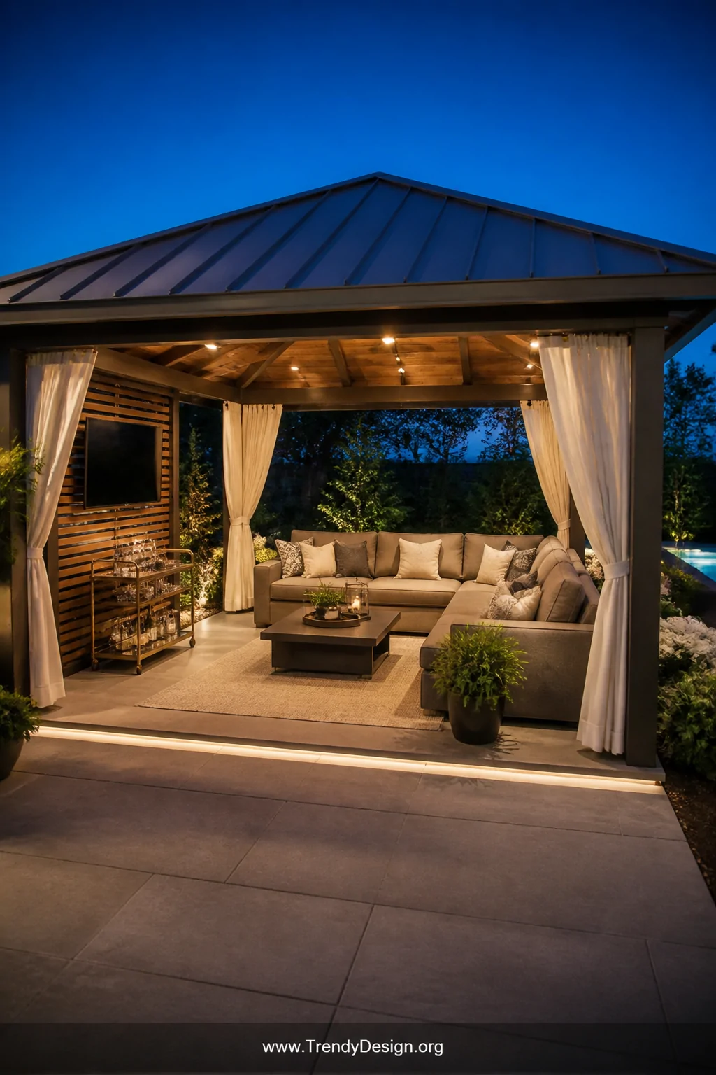 A wide photorealistic shot of a large rectangular entertainment pavilion gazebo at least 16 by 20 feet, a standing-seam metal