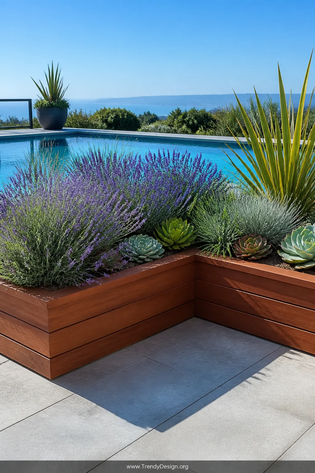 A photorealistic wide shot of a pool deck corner featuring a U-shaped raised cedar planter box overflowing with purple lavend