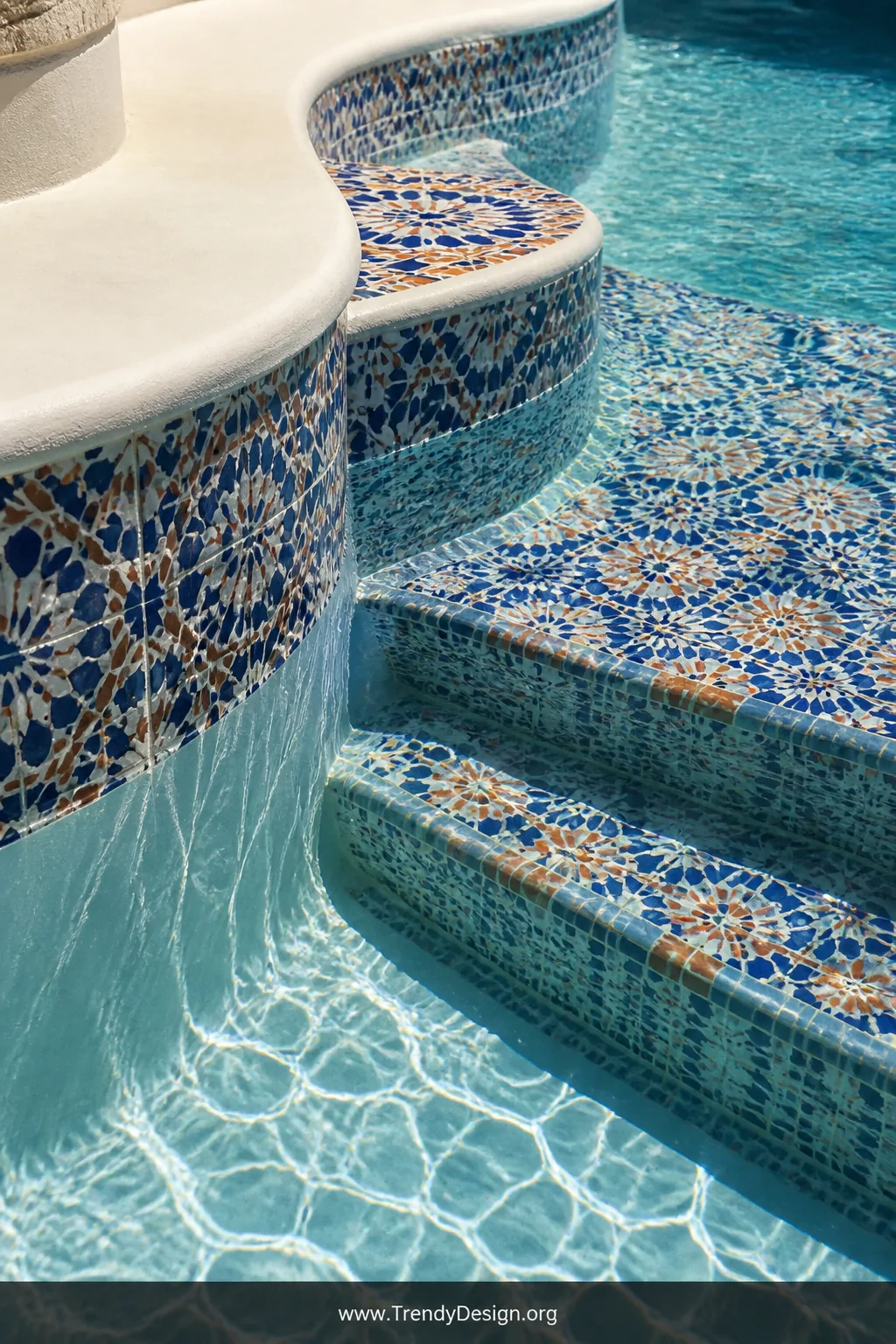Detail closeup shot of the interior pool wall of a finished DIY concrete block pool, surface covered in hand-laid Mediterrane