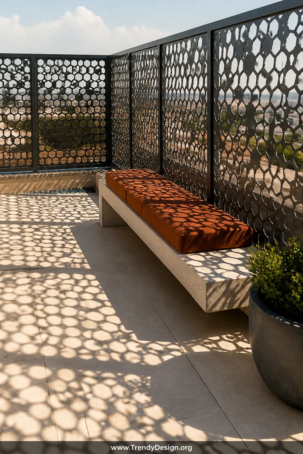 Medium photorealistic shot of a flat rooftop terrace enclosed by geometric hexagon-patterned laser-cut perforated steel panel