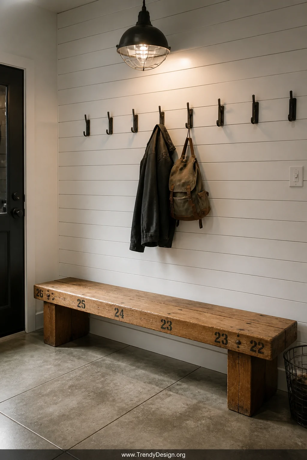 Medium mudroom shot of a sturdy reclaimed gym floor maple bench with thick plank seat surface showing original faded position