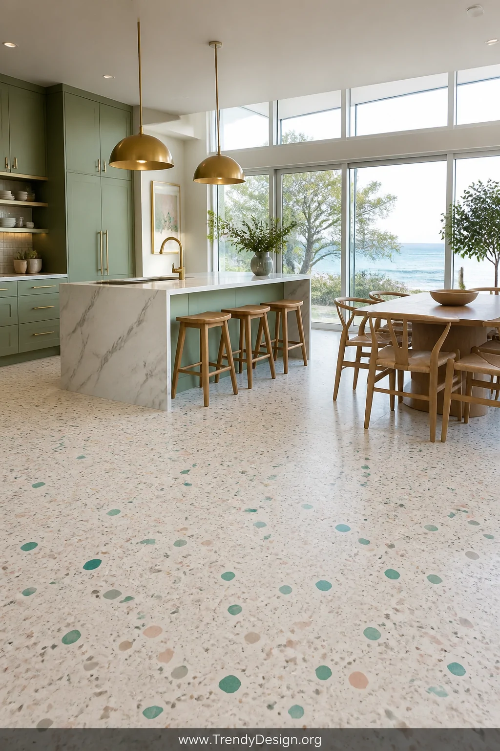 Wide photorealistic open-plan kitchen and dining space featuring poured-in-place recycled terrazzo flooring in a soft warm wh