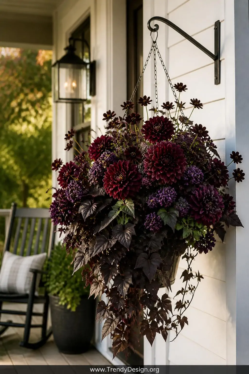 A medium-shot photorealistic exterior scene of a farmhouse-style porch featuring a dramatic moody hanging basket overflowing 