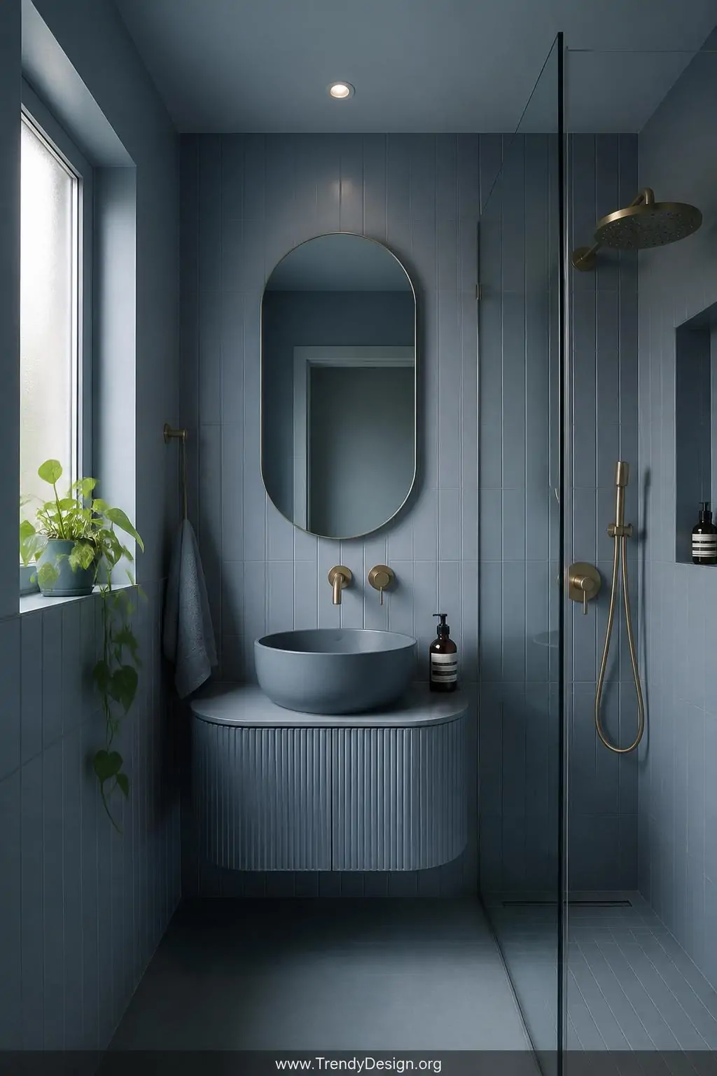 Medium photorealistic interior design shot of a small bathroom enveloped in a soft dusty blue monochromatic palette where flo