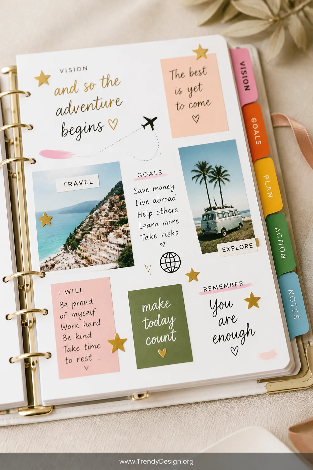 A close-up detail shot of a colorful vision board planner tab section spread open on a cream linen surface, featuring hand-le