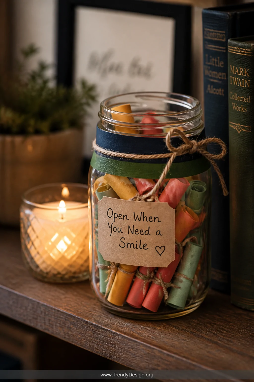 A styled wooden shelf vignette featuring a glass mason jar wrapped in navy and forest green washi tape and tied with a rustic