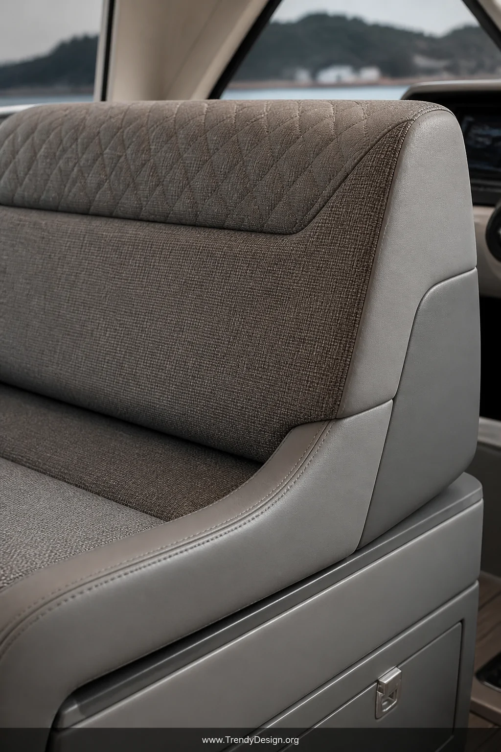 Close-up detail shot of a high-end boat helm seat combining smooth marine vinyl base panels with richly textured woven Sunbre