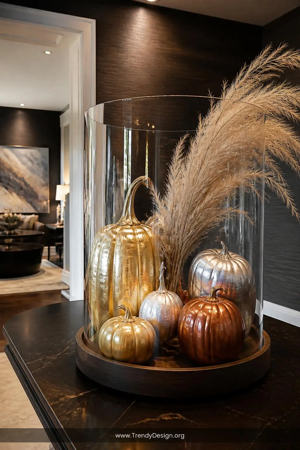 A wide-shot photorealistic interior of a sophisticated living room entryway featuring a grouping of five gold, silver, and co