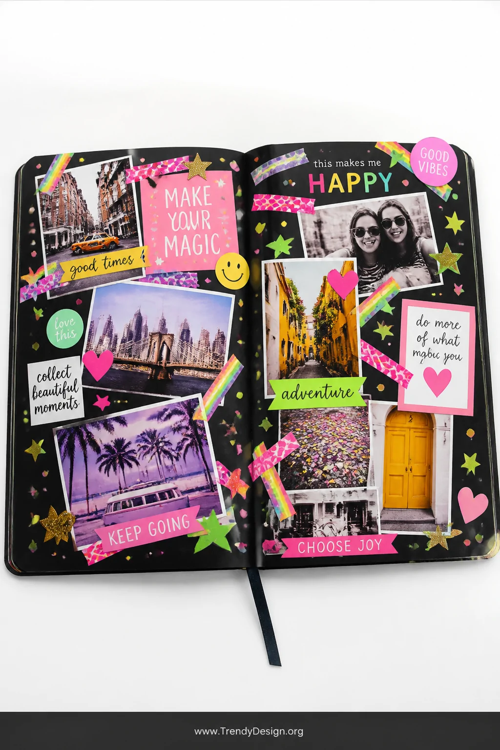 A wide-shot photorealistic styled interior flat-lay of a black scrapbook sprawled open on a bright white acrylic surface unde