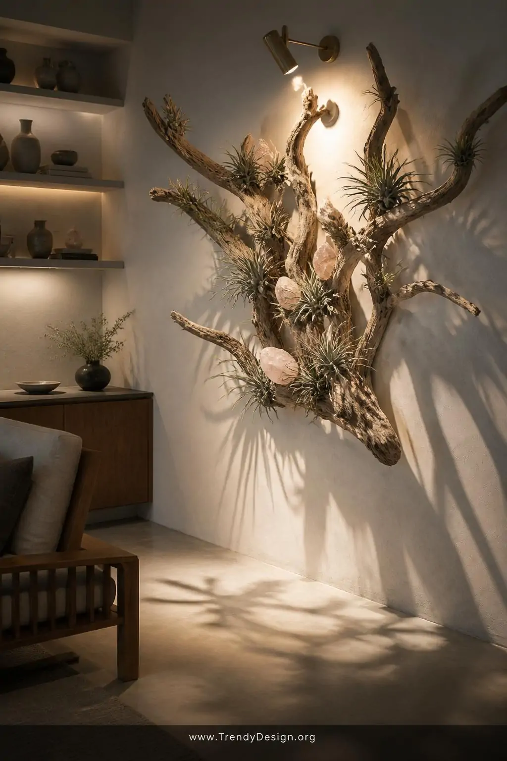 A wide shot of a serene Japandi-inspired living room corner where a large sculptural piece of bleached branching driftwood is