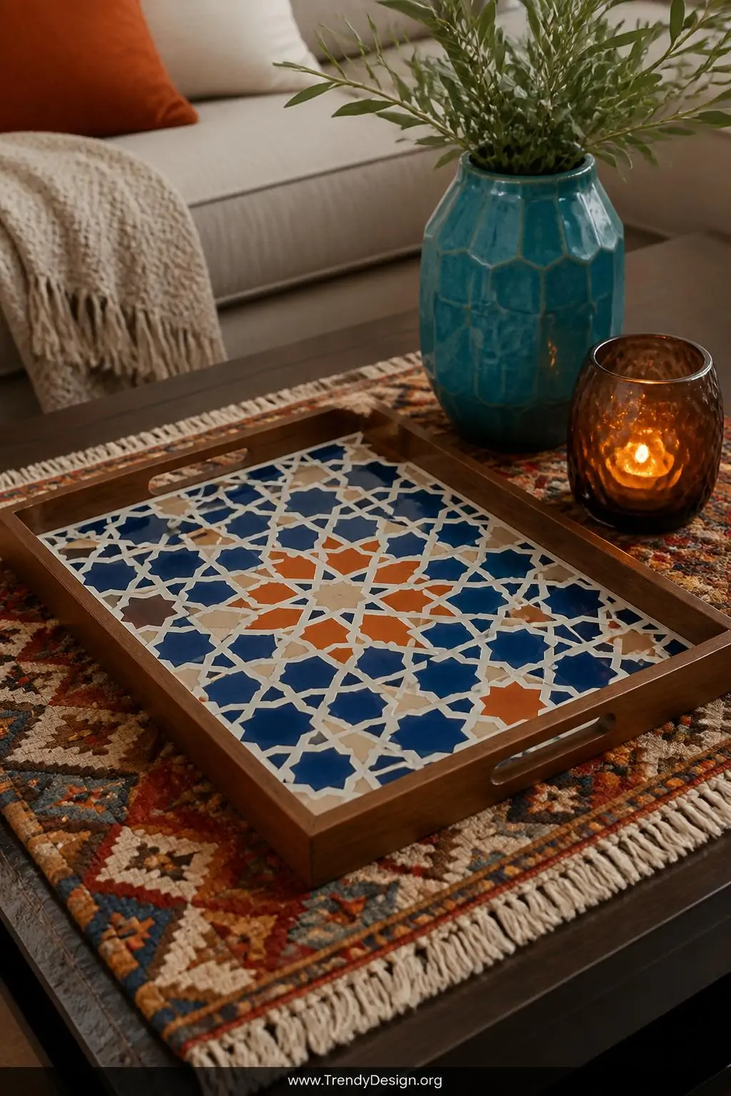 Closeup shot of a flat wooden tray tiled with hand-laid geometric Moroccan-inspired mosaic tiles in deep cobalt blue, ivory, 