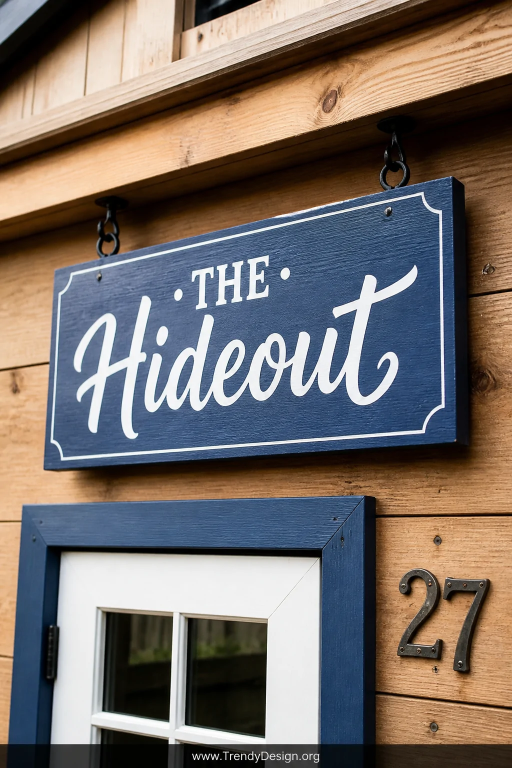 Close-up detail shot of a custom painted wooden sign reading 