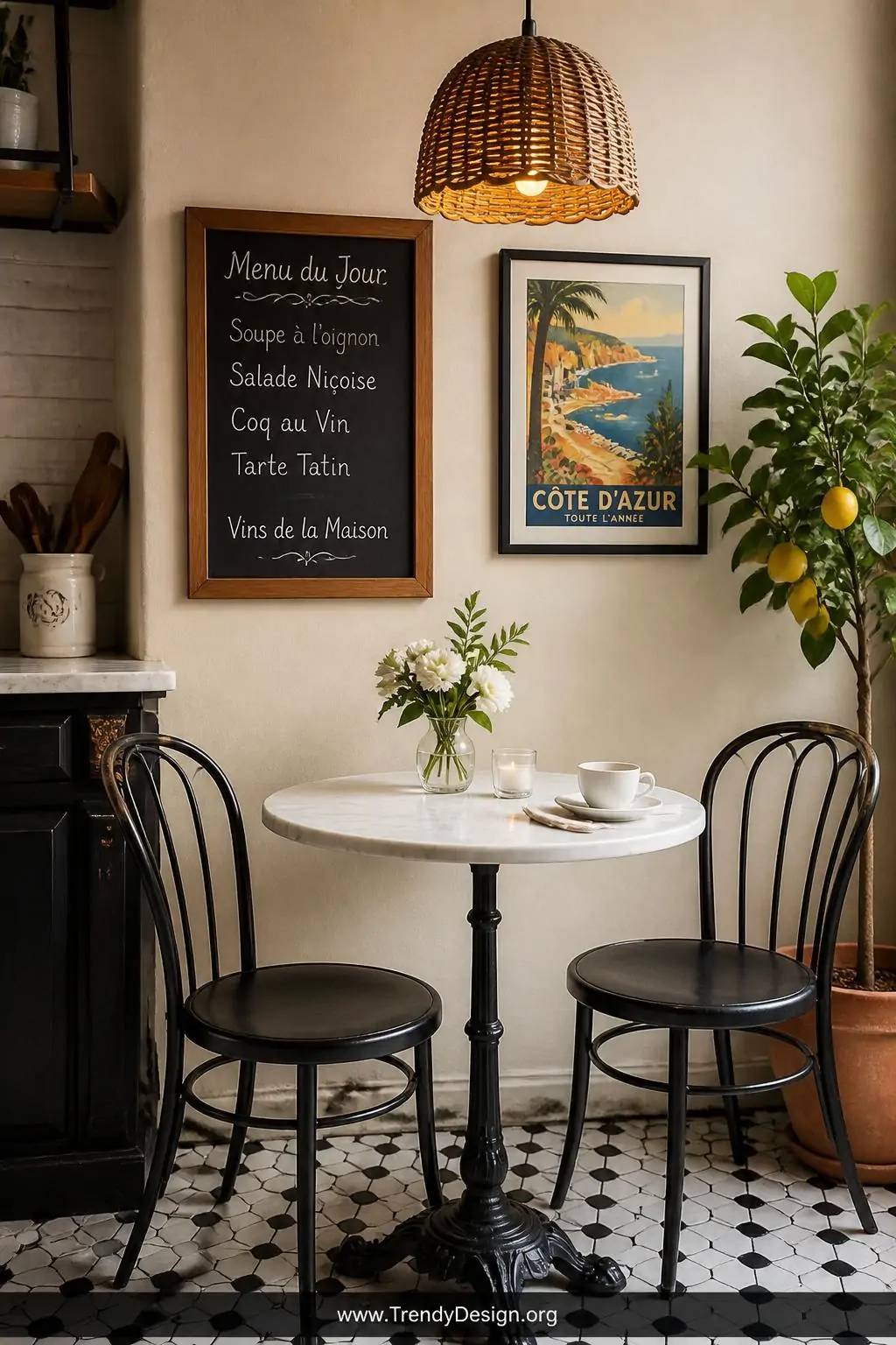 Closeup shot of a French bistro kitchen nook corner with a small round white marble-topped table on a black iron pedestal bas
