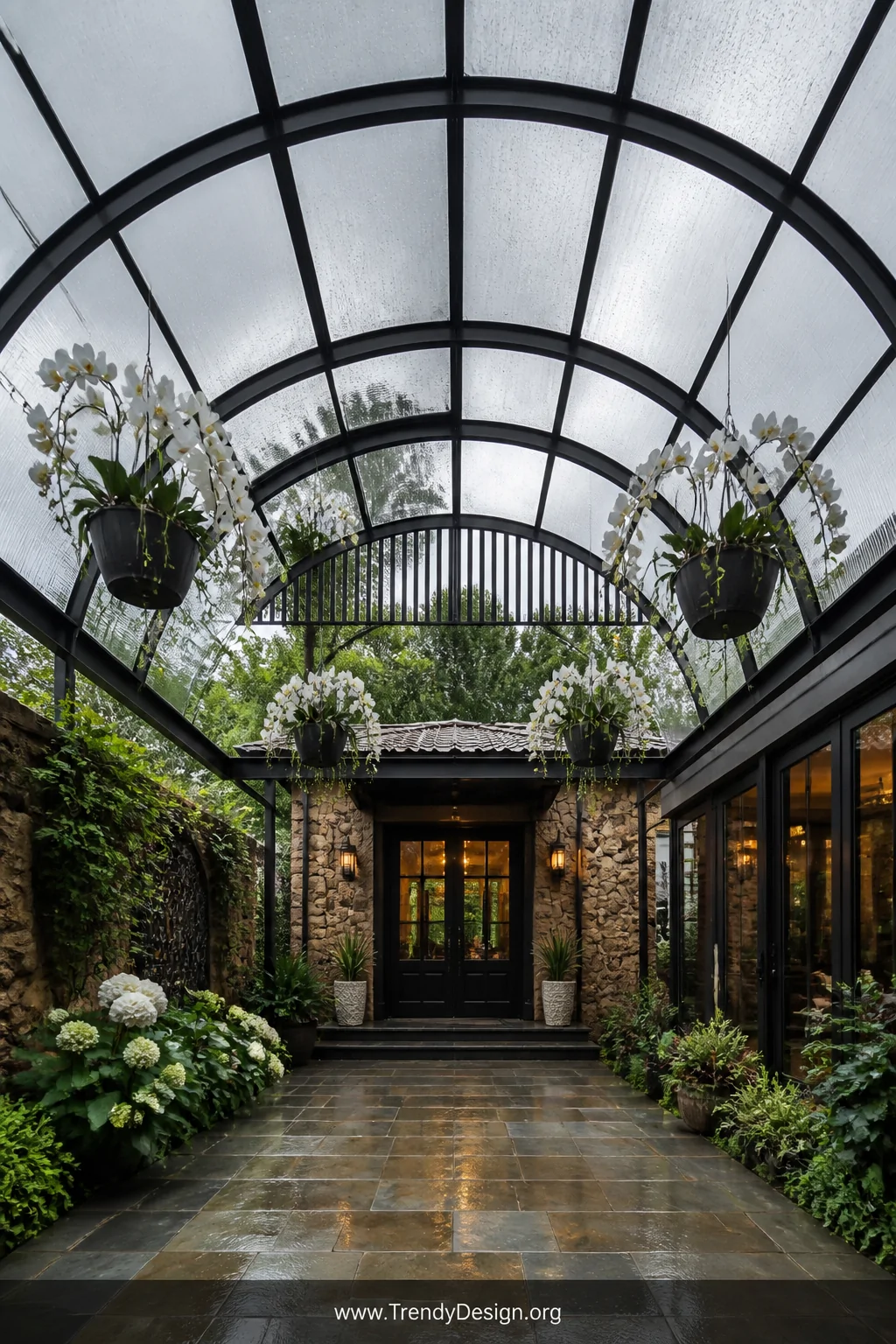 A dramatic medium shot looking upward at a curved arched clear polycarbonate roof supported by powder-coated steel arched fra