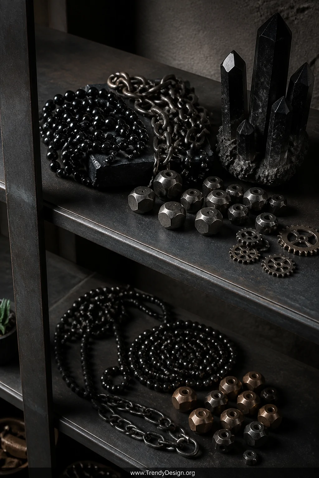 Close-up detail shot of an industrial-style dark steel shelving unit displaying arranged dark hematite beads, gunmetal chain 