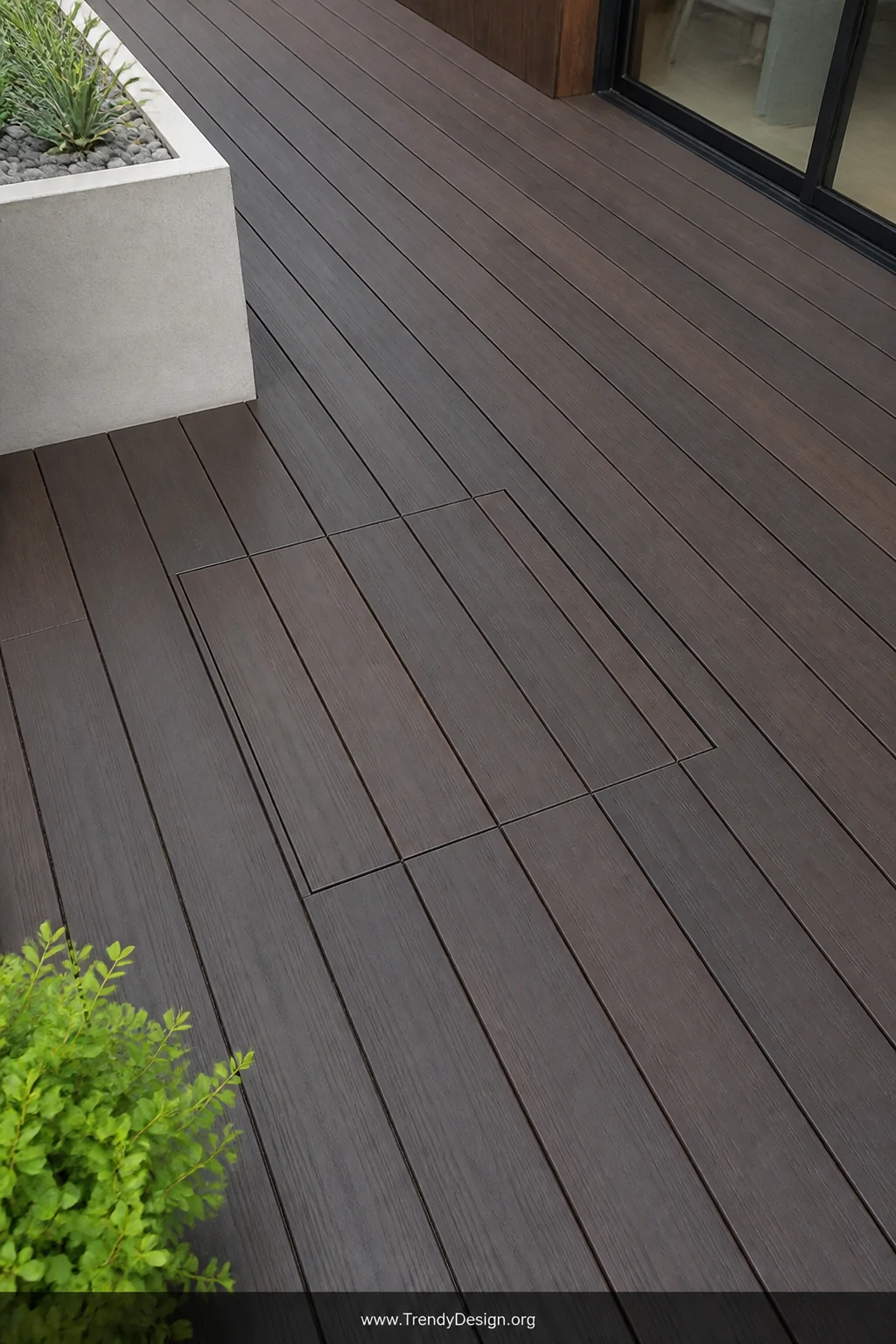 Medium overhead shot of a seamless flush frameless deck trap door perfectly integrated into contemporary dark-stained hardwoo