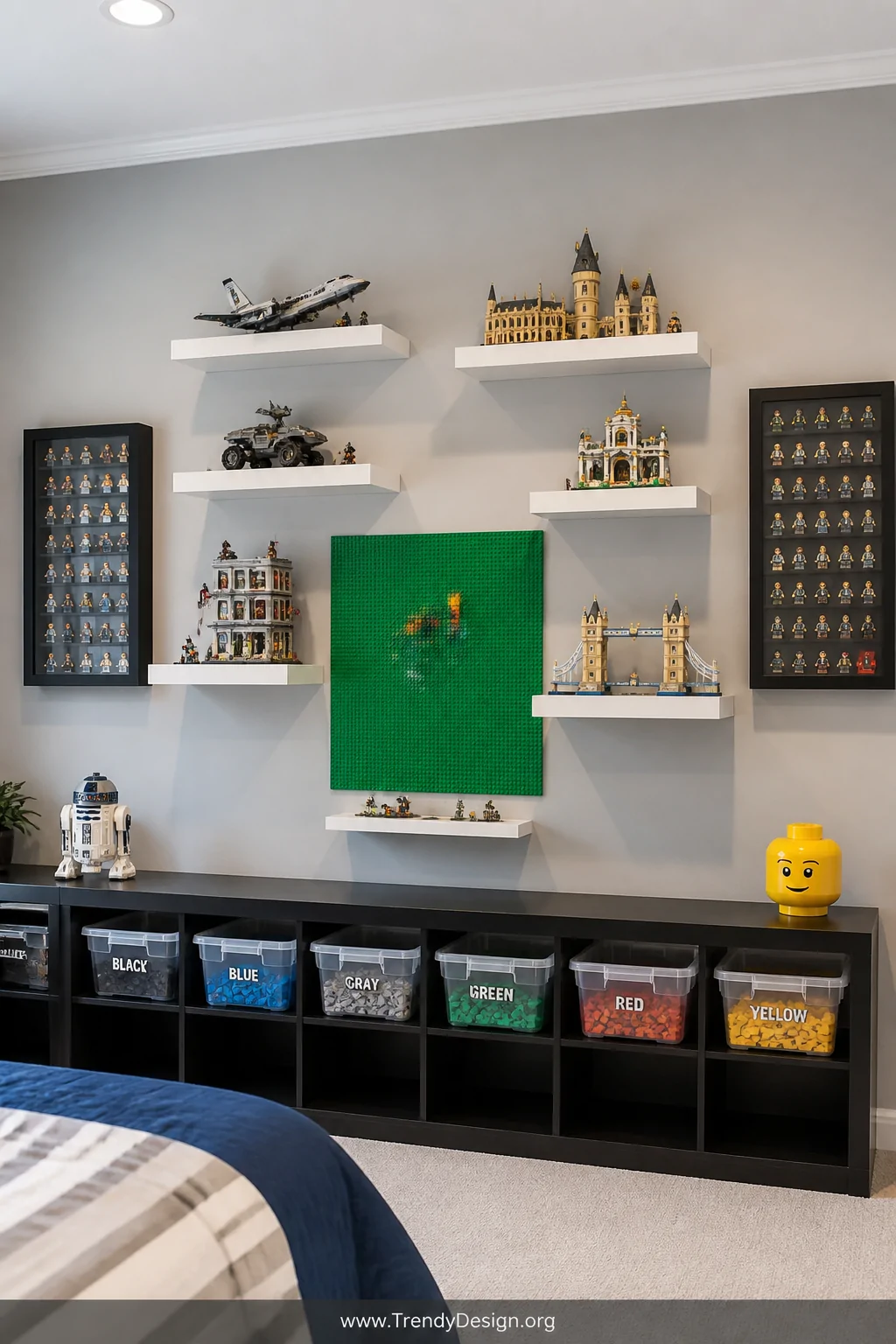 Wide shot of a LEGO display wall in a boys bedroom featuring white floating shelves mounted at varying heights showcasing col