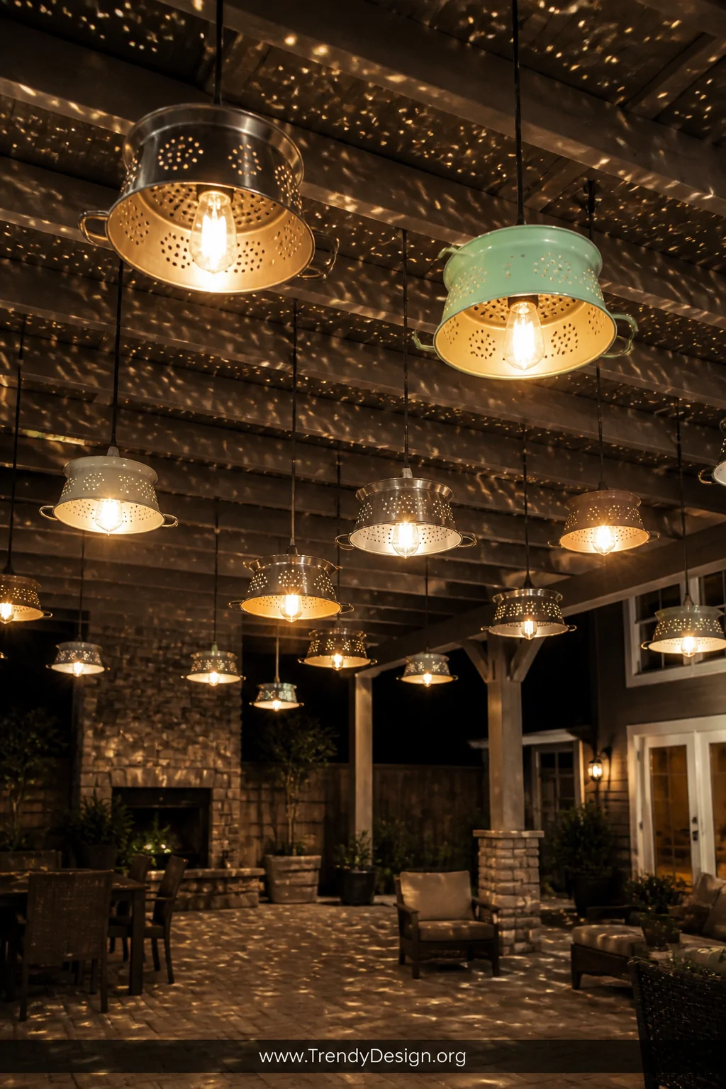 A medium overhead shot looking up at a cluster of metal colanders hanging at varying heights from a pergola ceiling, an Ediso