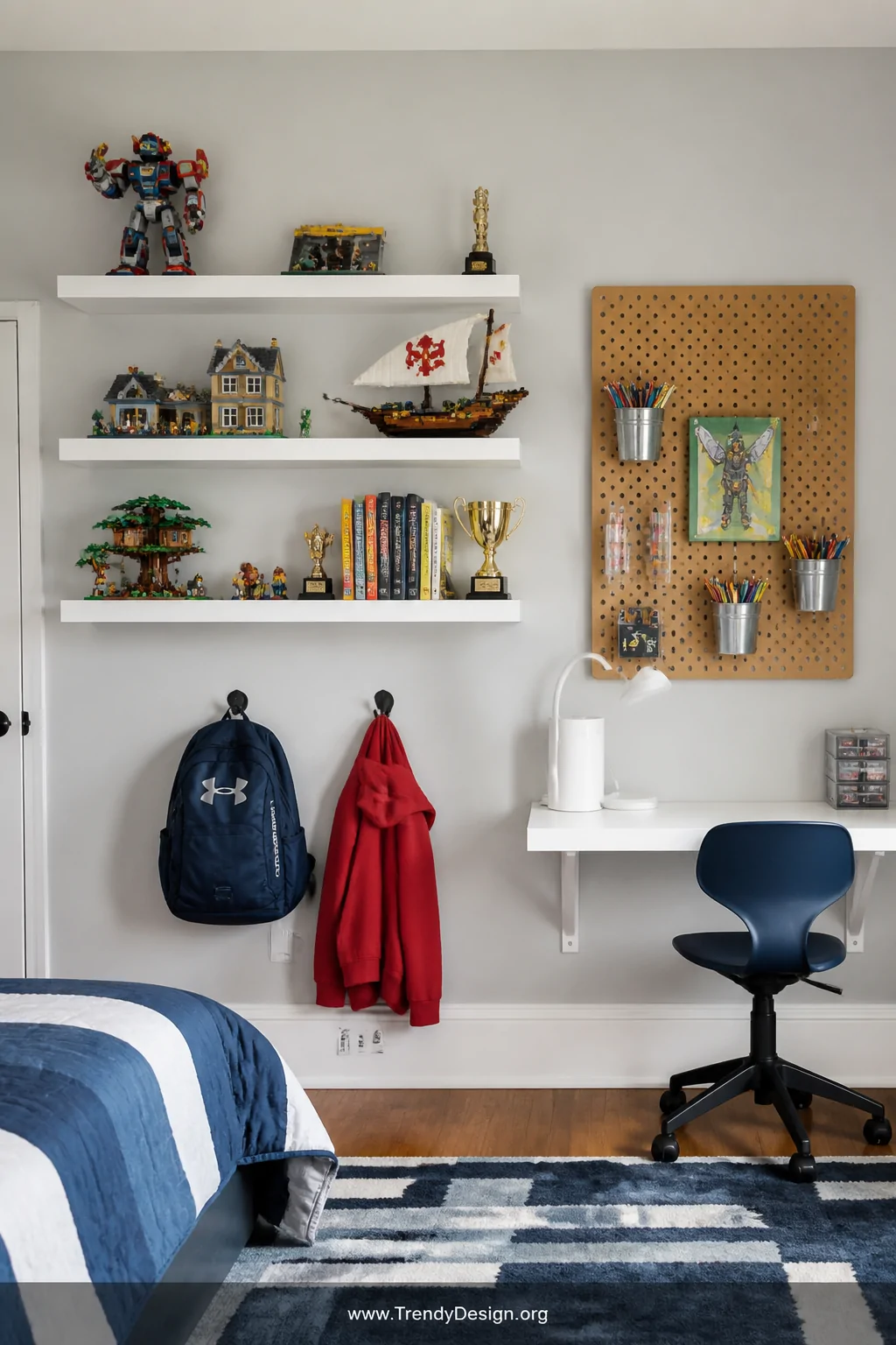 Medium shot of a well-organized boy's bedroom wall featuring white floating shelves displaying proud rows of colorful Lego bu