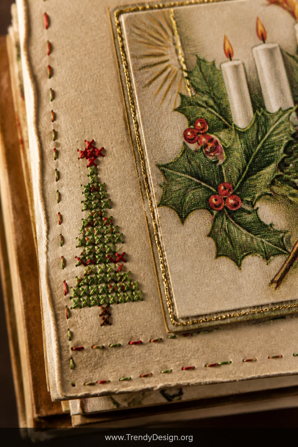 Macro closeup shot of a junk journal page corner where red and green embroidery floss forms delicate running stitches and a s