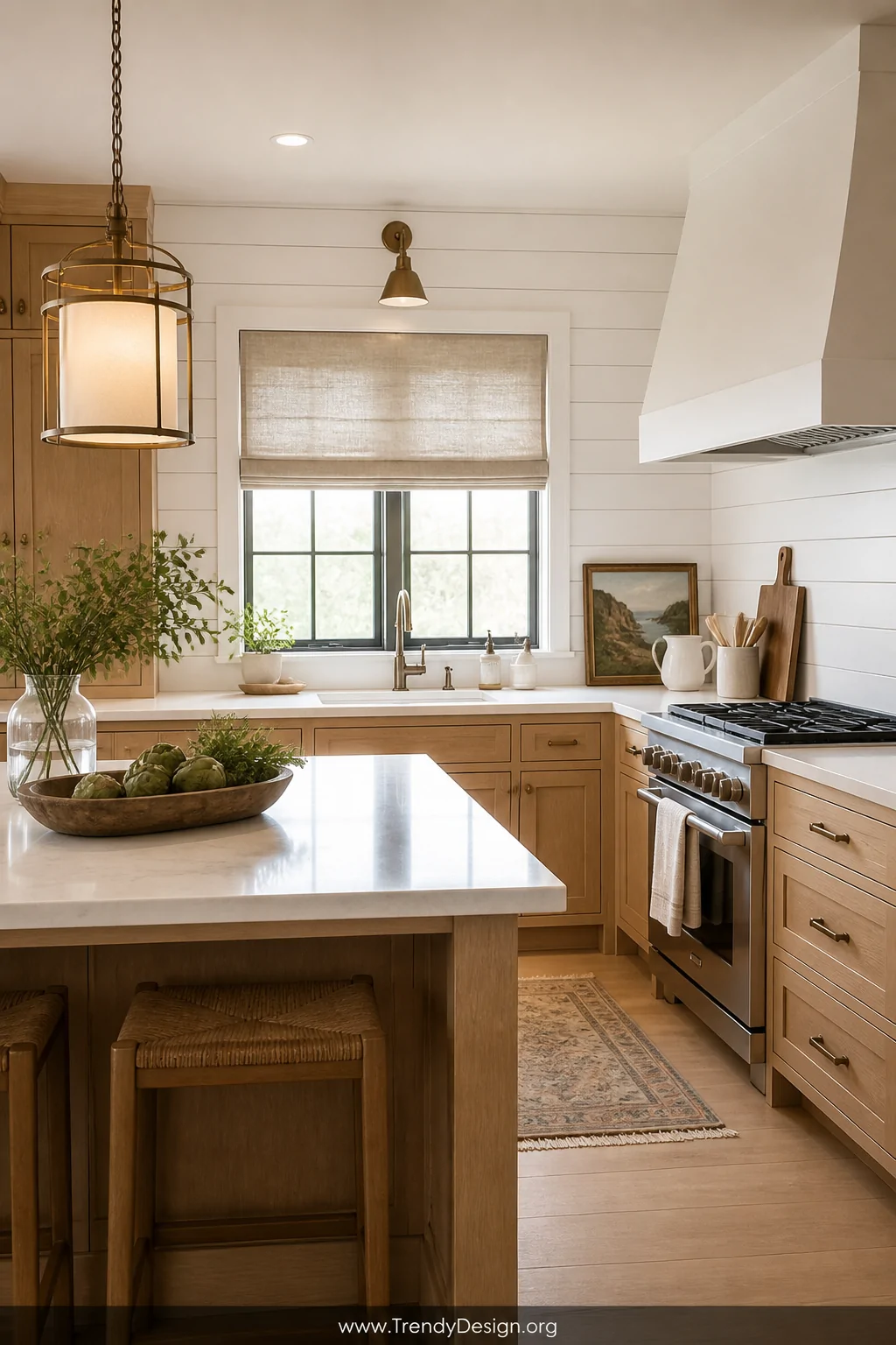 Wide shot of a coastal cottage kitchen with crisp white painted shiplap backsplash panels running horizontally behind the sin