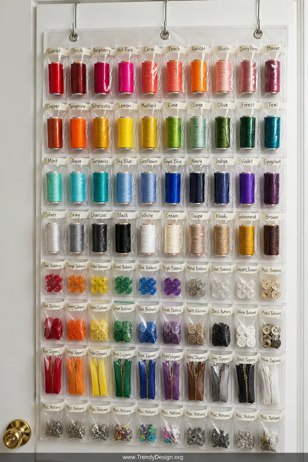Close-up photorealistic detail shot of a clear hanging shoe organizer mounted on the back of a white closet door, its pockets